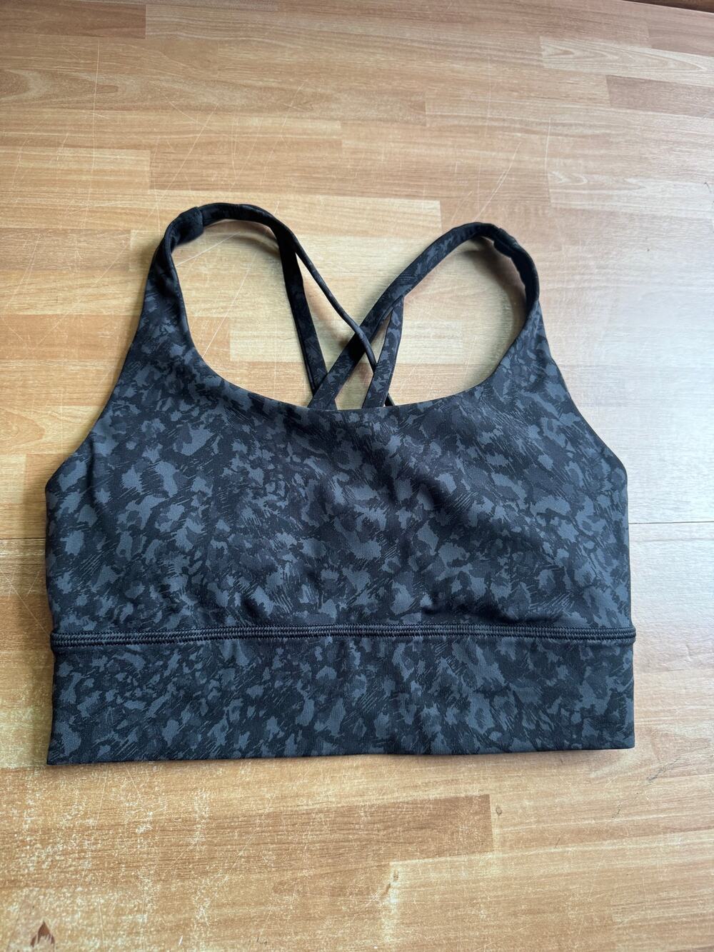 Lululemon Energy Longline Bra featuring a black leopard print pattern.